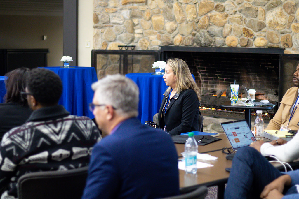 Council program participants listening and working together around a table