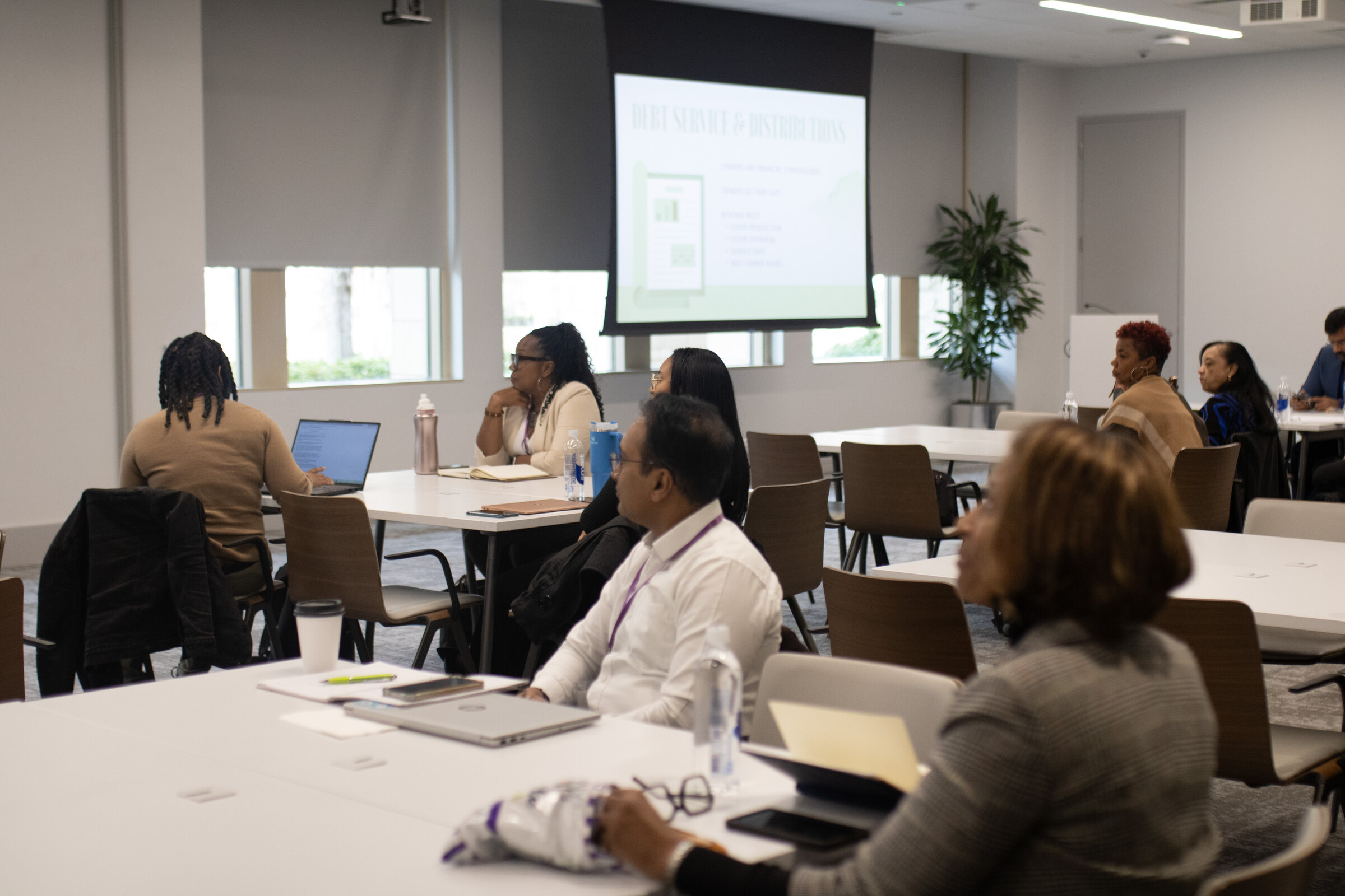 A facilitator leading business owners during a Council workshop